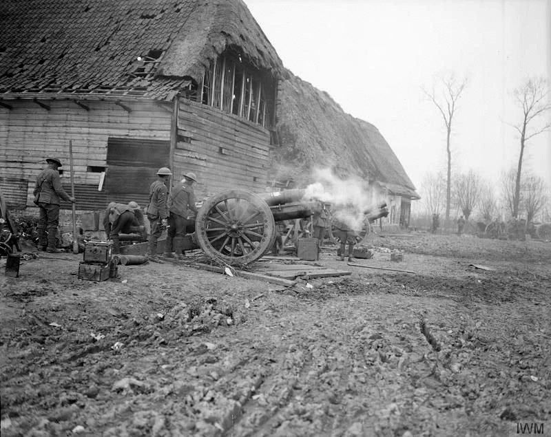 6-inch howitzer battery of the Royal Garrison Artillery in action at a farm near Strazeele 13th April 1918 at the Battle of Hazebrouck during German Spring Offensive. From Wikipedia Commons. © IWM Q8723