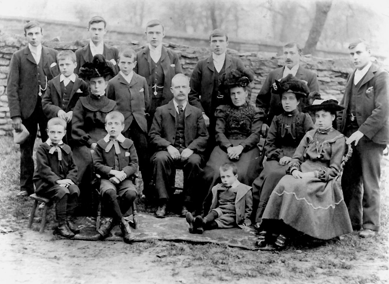 Annie and William with their eleven sons and three daughters. The family are (from left) Back Row: Albert, William, Fred, Richard, Thomas, John. The two young boys standing in front of this row are Arthur and Walter. The older seated row are Sarah, William, Annie, Elizabeth and Eva. The three youngest boys seated in the front are Alfred, Sidney and Ernest. (Taken about 1903)