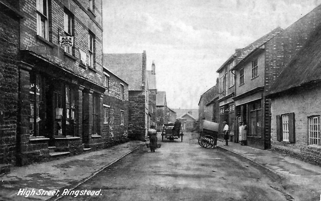 Ringstead High Street in 1920s Post Office now moved to its present (2013) site and Co-op with bread cart outside. The milk cart is moving away. Is the woman with the buckets delivering milk or carrying water from the pump? With the kind permission of Vivienne Marshall