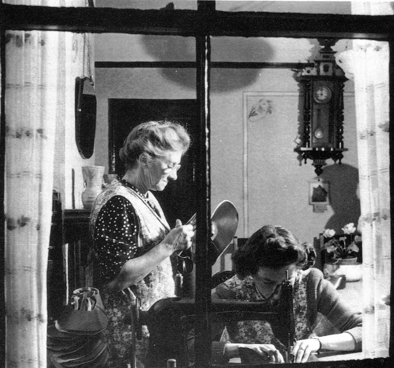 This photo is wrong in many ways. It is the wrong county (Norfolk), is not army boots work, is a little later than our period and the woman is using a sewing machine which Susannah probably did not. Nevertheless it gives a feeling of the way women had to fit the work into the domestic routine - and such photographs are rare - so is worth including for that reason. Norfolk & Norwich Millennium Museum (original believed to have been destroyed in fire).