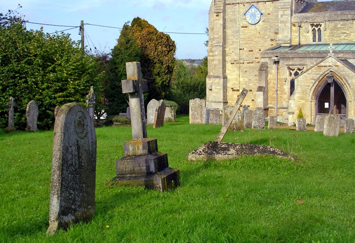 William Leveratt’s grave in the foreground with the cross of his daughter Elizabeth (and her husband and baby daughter) standing next to it in Denford Churchyard.