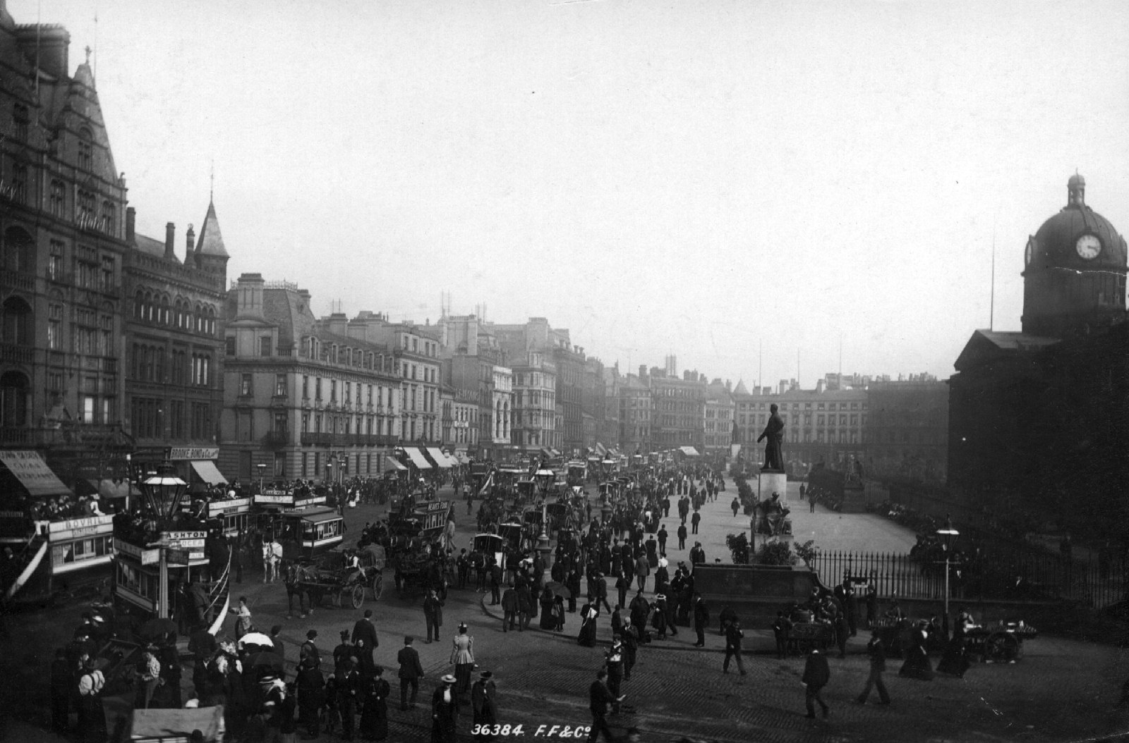 Manchester Piccadilly in 1892 showing the horse-drawn trams, the crowds and the new tall buildings of the modern city.